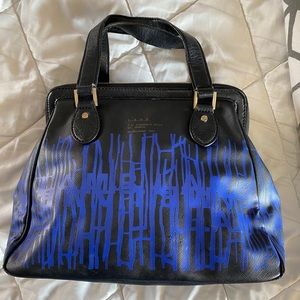 L.A.M.B Satchel Blue with Black Drip Paint